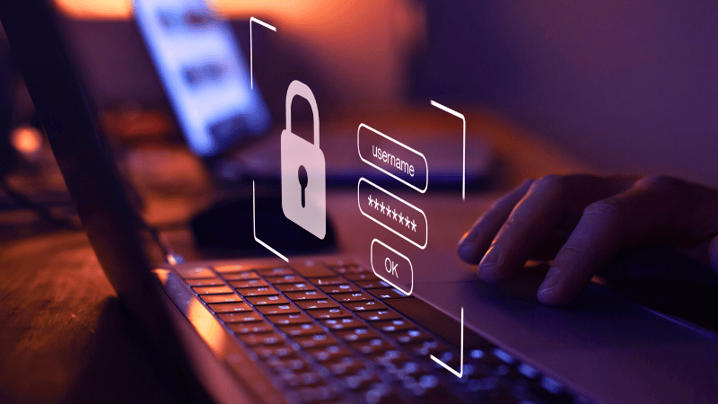 A person at a laptop with a hovering display showing a padlock and login fields for an enterprise payment platform.